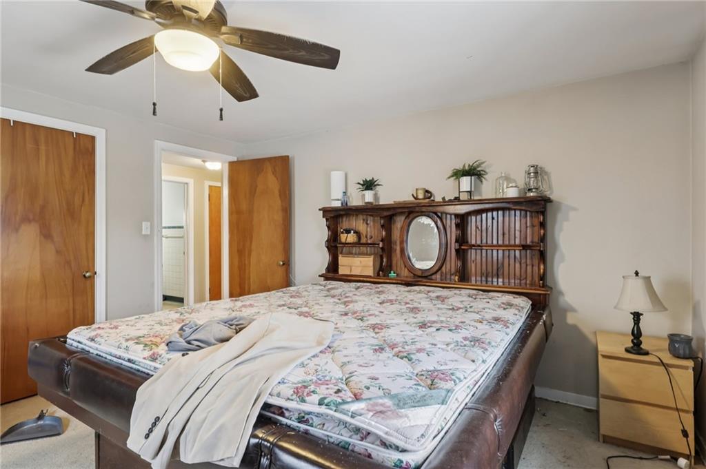 101 East Patterson Avenue Butler, PA 16001 - Photo 25 of 25 a bedroom with a bed and a chandelier