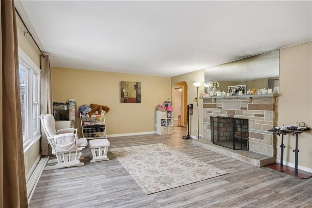 101 East Patterson Avenue Butler, PA 16001 - Photo 4 of 25 a living room with furniture and a fireplace