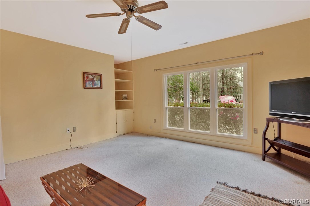 3907 Timber Ridge Place Midlothian, VA 23112 - Photo 11 of 32 a living room with furniture and a flat screen tv