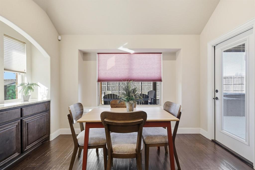 4609 Jasmine Trail Midlothian, TX 76065 - Photo 19 of 34 Dining room with lofted ceiling and dark wood-style flooring