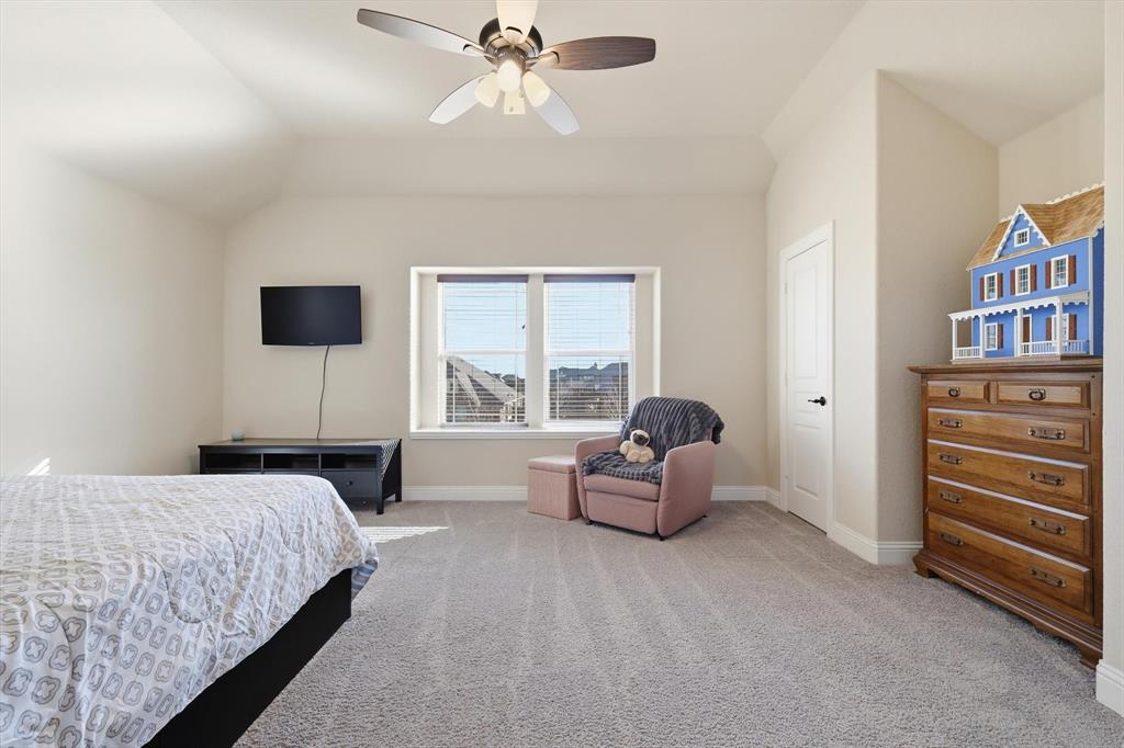 4609 Jasmine Trail Midlothian, TX 76065 - Photo 27 of 34 upstairs Carpeted bedroom featuring a ceiling fan and lofted ceiling