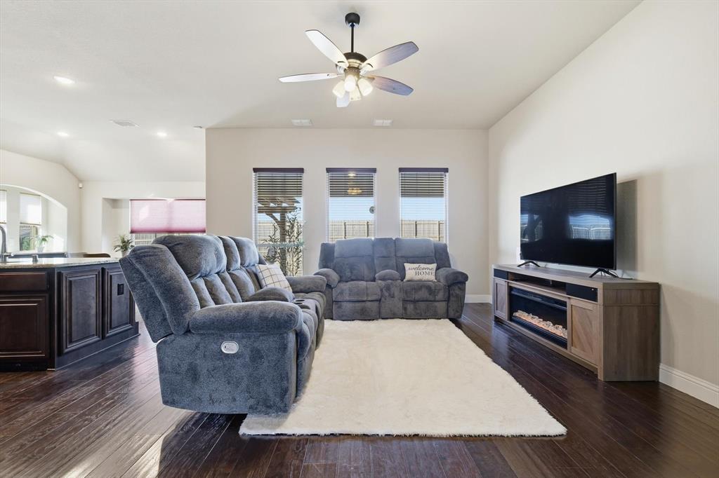 4609 Jasmine Trail Midlothian, TX 76065 - Photo 5 of 34 Living room featuring engineered wood floors, a ceiling fan, and tall ceiling
