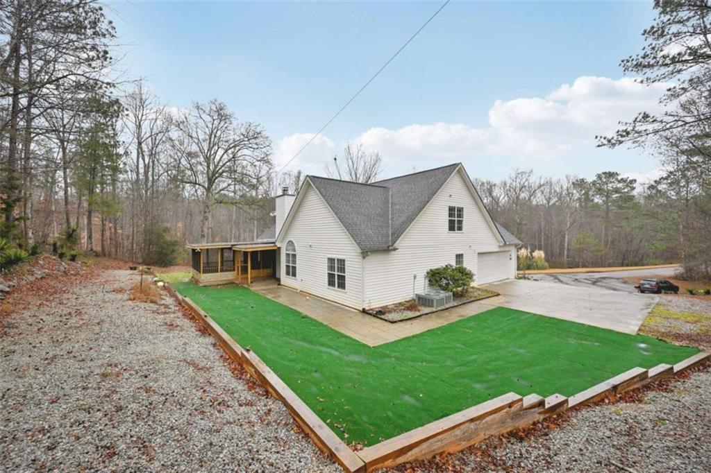 25 Castlehill Court Covington, GA 30016 - Photo 32 of 32 a view of a house with a yard and pathway