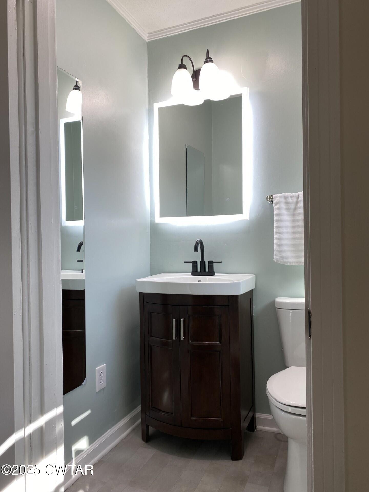 208 4th Street Henderson, TN 38340 - Photo 38 of 62 a bathroom with a sink and a toilet