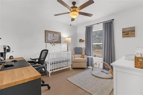 a bedroom with furniture and a window