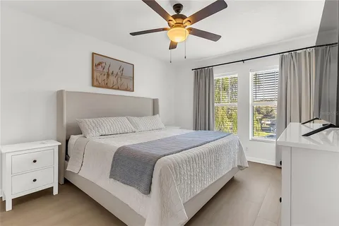 a bed room with a bed and a chandelier