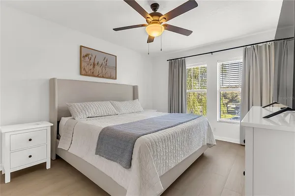 a bed room with a bed and a chandelier