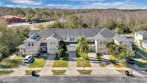 a view of multiple houses with a street