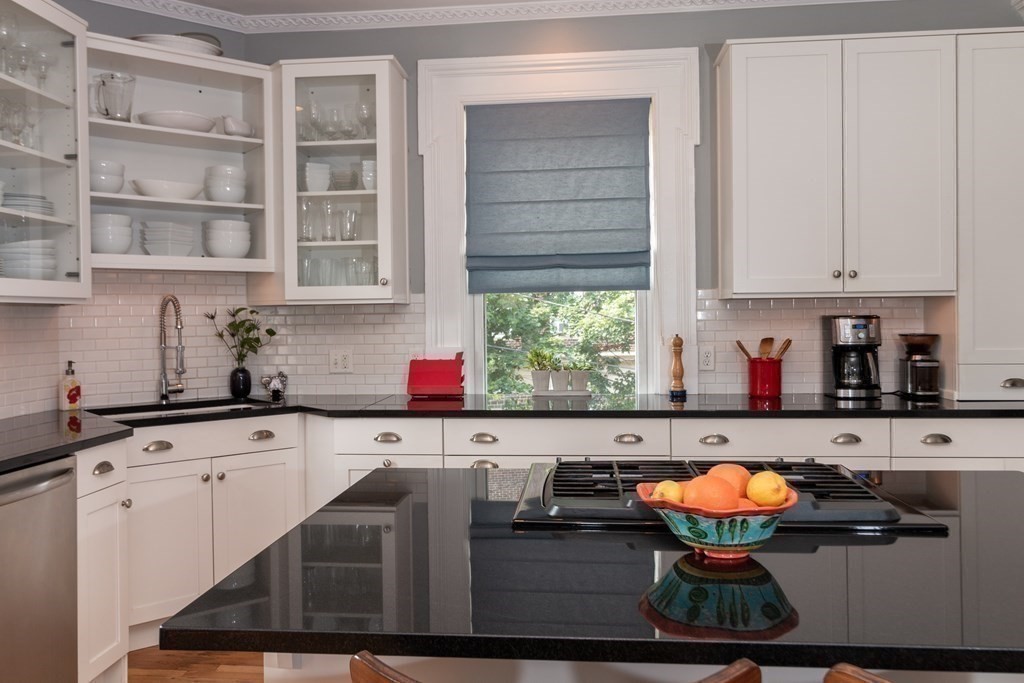 70 Cherry Street, Unit 1 Lynn, MA 01902 - Photo 21 of 40 a kitchen with stainless steel appliances granite countertop a sink and cabinets