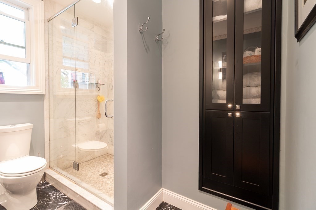 70 Cherry Street, Unit 1 Lynn, MA 01902 - Photo 30 of 40 a bathroom with a glass shower door