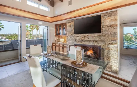 a living room with fireplace furniture and a flat screen tv