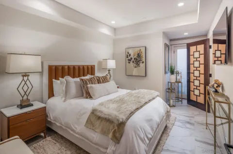 a bed room with a bed and a night stand