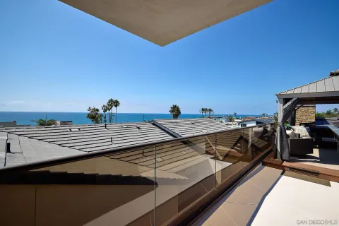 a view of city from balcony with furniture