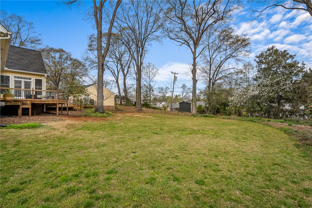 401 Berkshire Hill Anderson, SC 29621 - Photo 39 of 39 Expansive green lawn and a charming elevated deck, perfect for outdoor living.