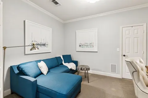 a spacious bathroom with a granite countertop tub a double vanity sink a large mirror and a large window