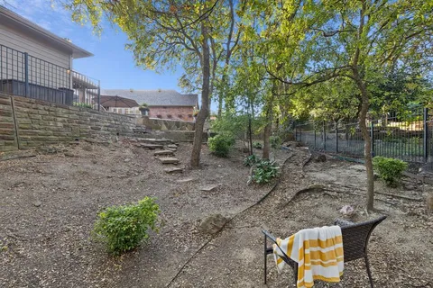 a view of a swimming pool with a yard