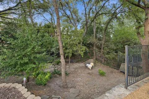 a view of a house with swimming pool and sitting area