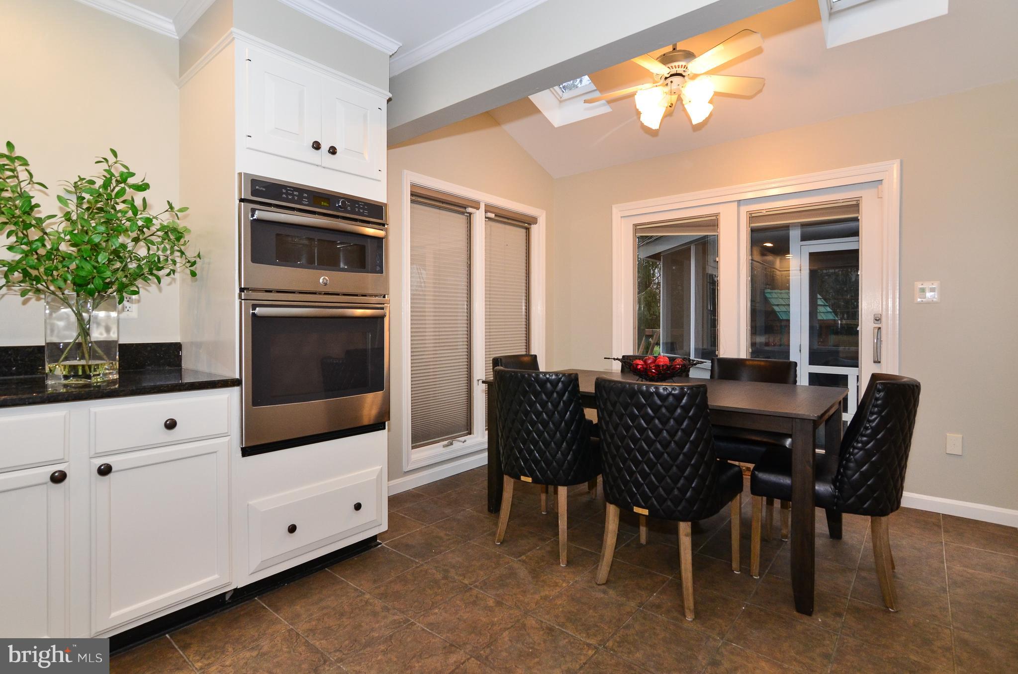 9712 Spring Ridge Lane Vienna, VA 22182 - Photo 23 of 46 Spacious table space leads to screened in porch