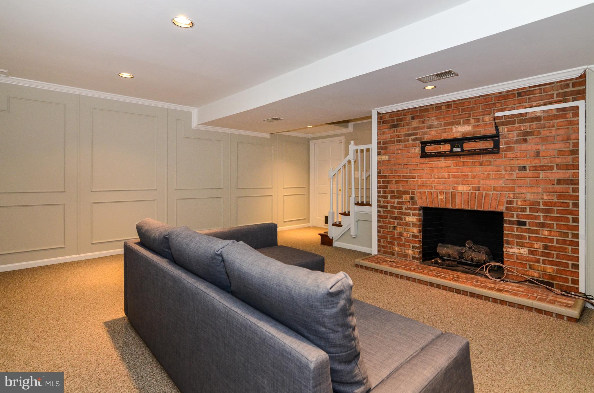 9712 Spring Ridge Lane Vienna, VA 22182 - Photo 42 of 46 Family room with cozy fireplace on lower level