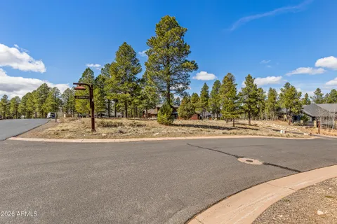 a view of a road with a building in the background