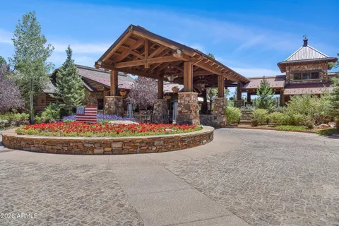 a view of residential houses with outdoor space and lake view