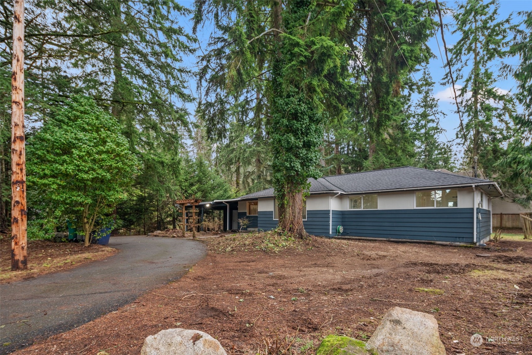 432 170th Place Southwest Bothell, WA 98012 - Photo 28 of 30 a front view of a house with a yard