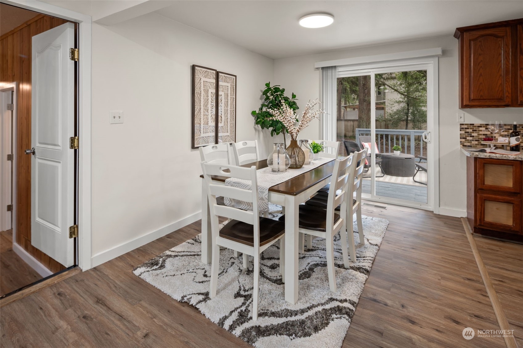 432 170th Place Southwest Bothell, WA 98012 - Photo 7 of 30 a view of a dining room with furniture window and wooden floor