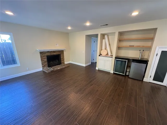 a view of a livingroom with wooden floor