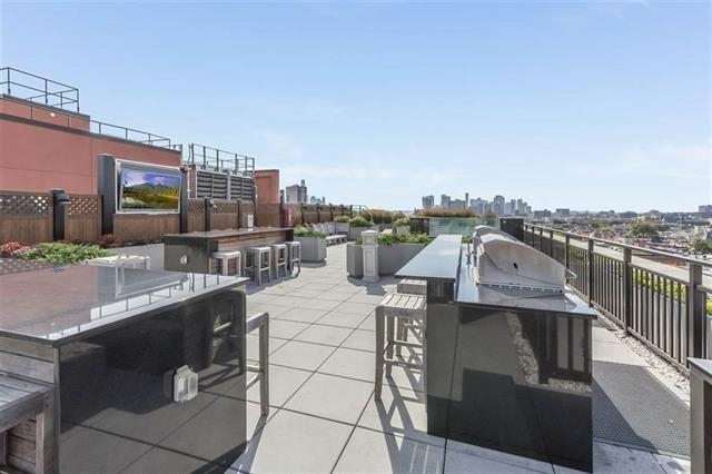 1100 Maxwell Lane, Unit 903 Hoboken, NJ 07030 - Photo 13 of 14 a view of city from terrace along with seating space