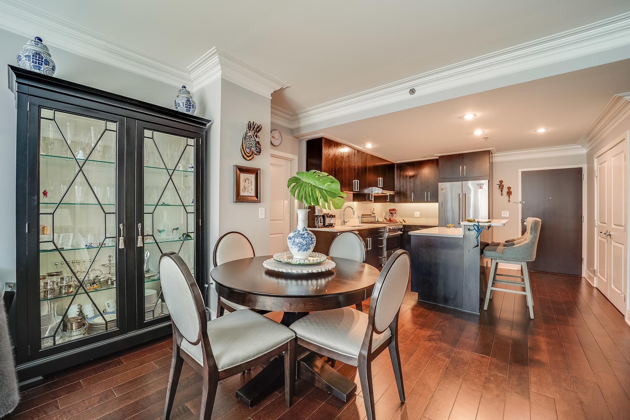 1100 Maxwell Lane, Unit 903 Hoboken, NJ 07030 - Photo 8 of 14 a dining room with furniture a window and wooden floor