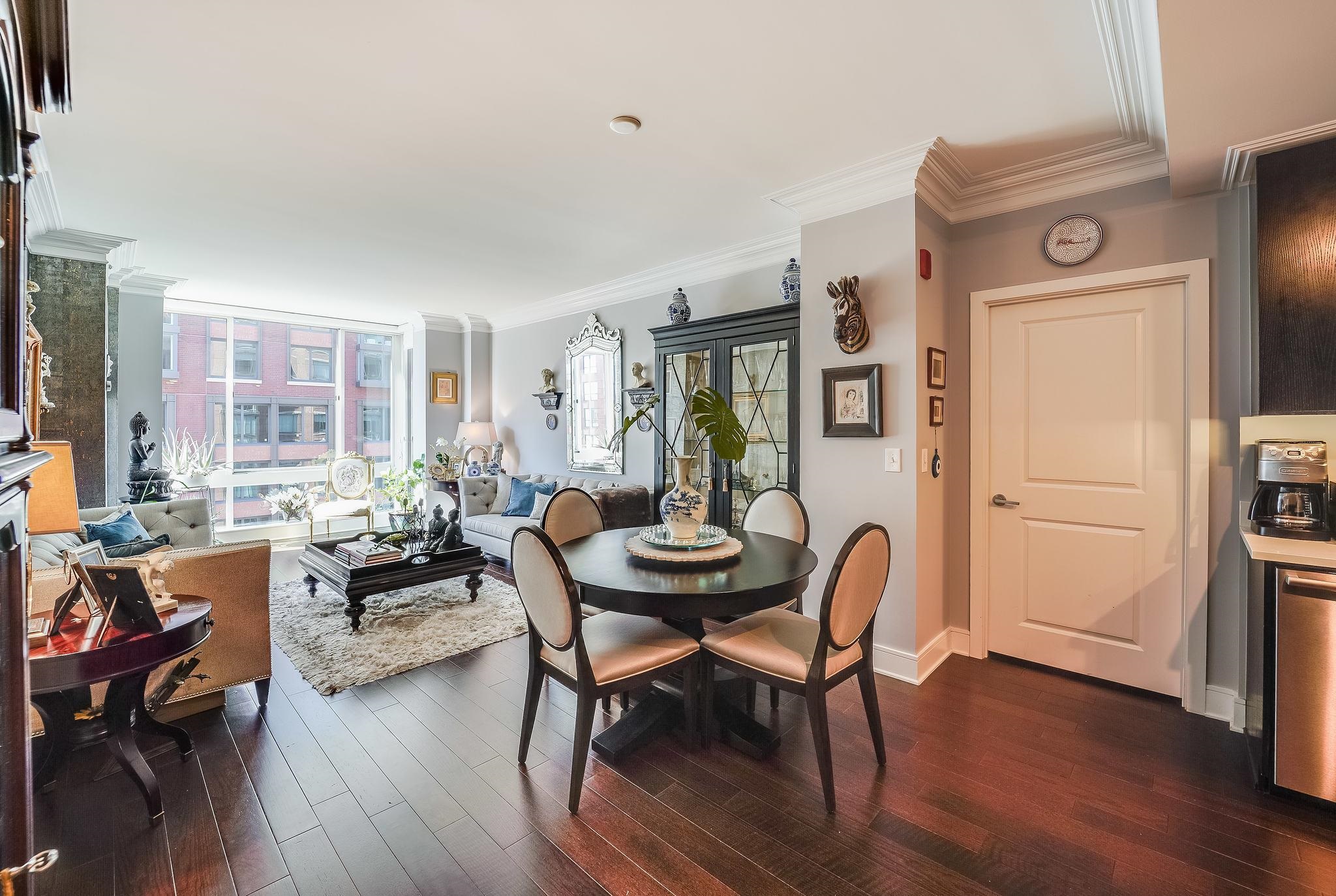 1100 Maxwell Lane, Unit 903 Hoboken, NJ 07030 - Photo 9 of 14 a dining room with furniture and wooden floor