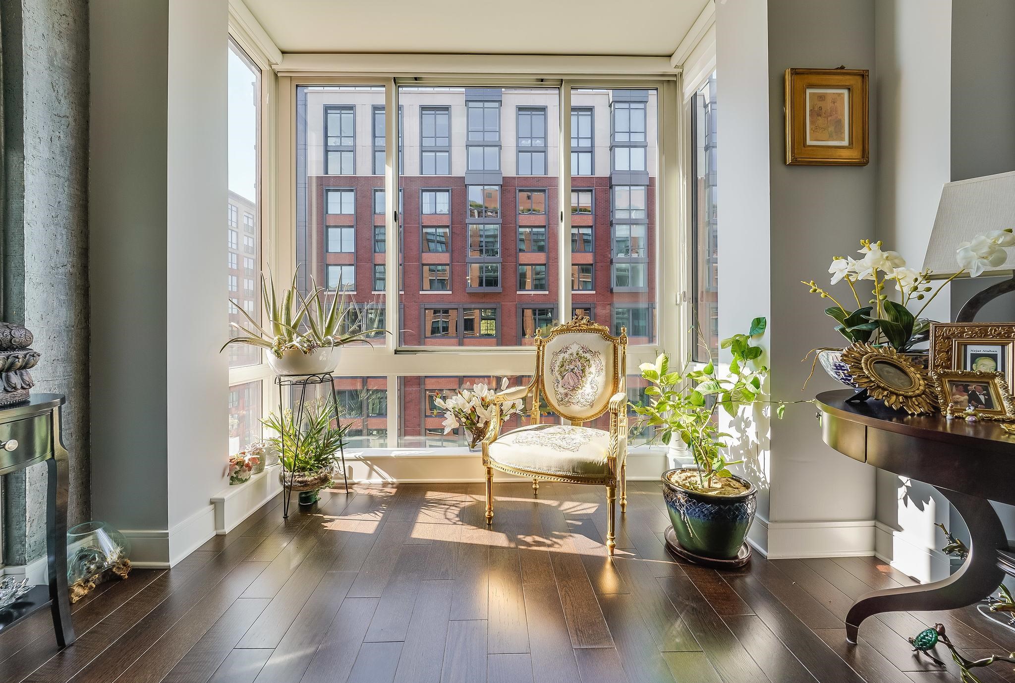1100 Maxwell Lane, Unit 903 Hoboken, NJ 07030 - Photo 10 of 14 a living room with furniture and a potted plant