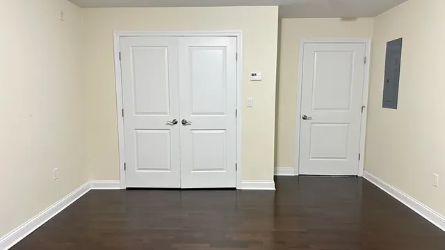 an empty room with wooden floor