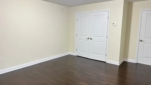 an empty room with wooden floor
