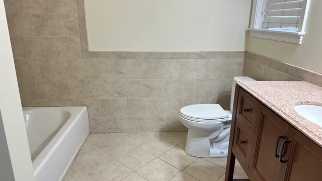 a bathroom with a sink a toilet and a bathtub