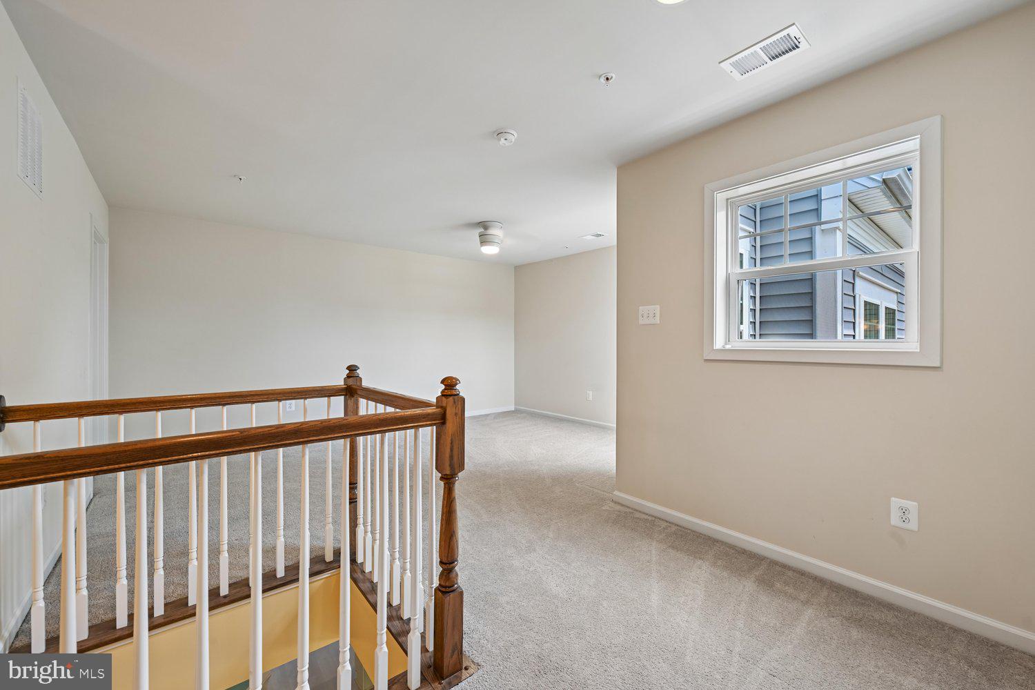 3068 Spring Peeper Court Odenton, MD 21113 - Photo 14 of 42 a view of a hallway with a window