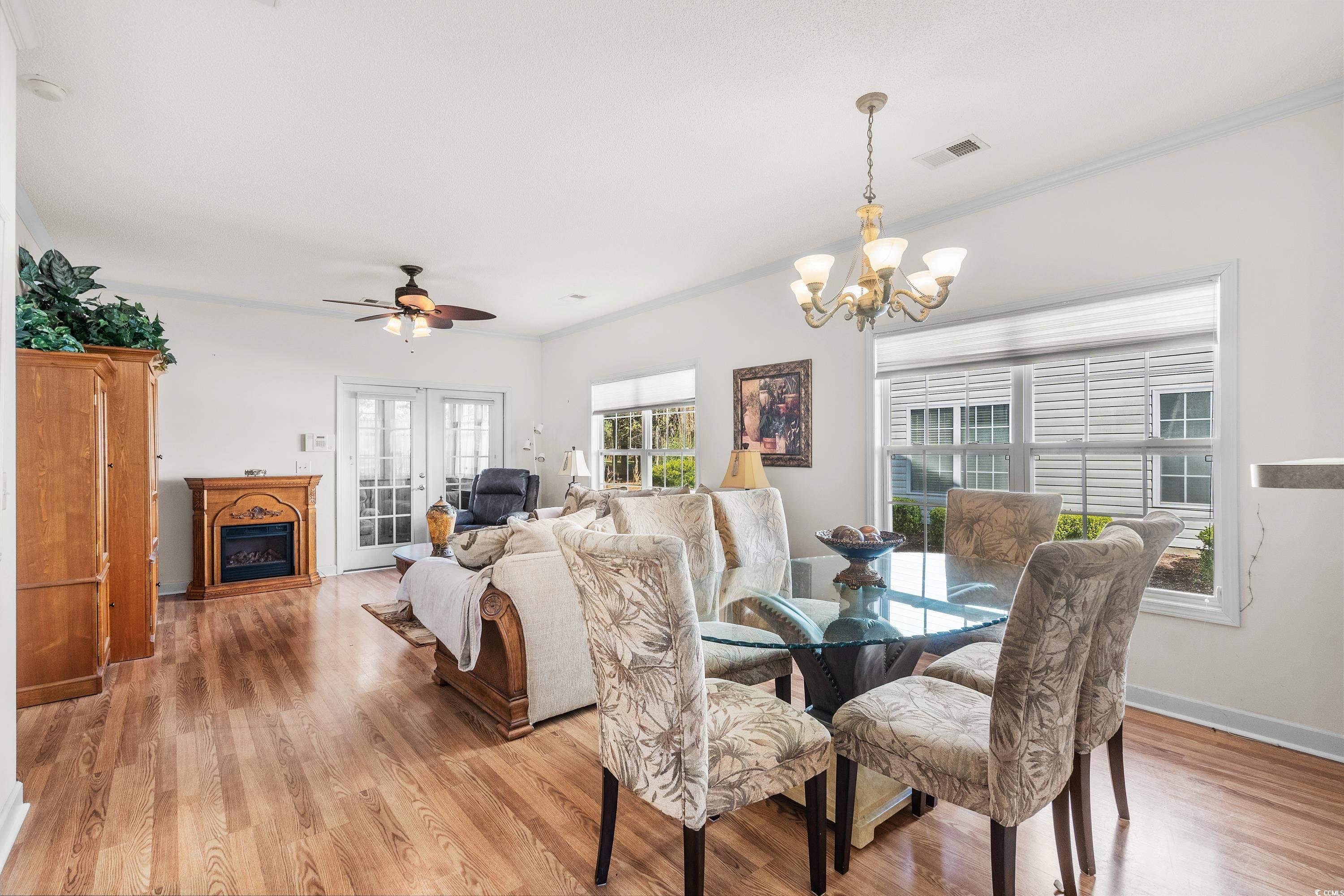 493 Shellbank Drive, Unit 2B Longs, SC 29568 - Photo 18 of 40 Dining space featuring ceiling fan with notable ch