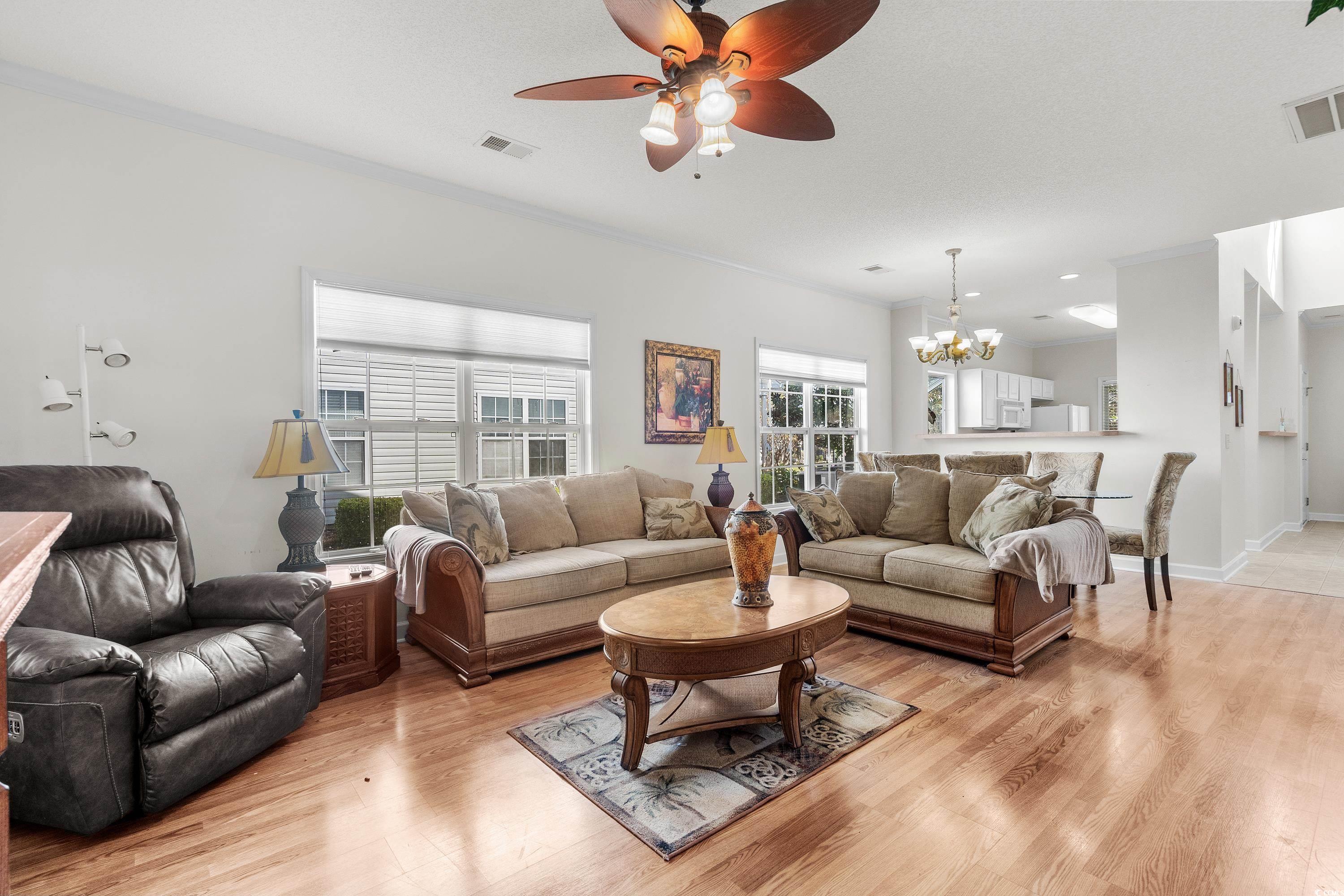 493 Shellbank Drive, Unit 2B Longs, SC 29568 - Photo 21 of 40 Living room featuring ceiling fan with notable cha