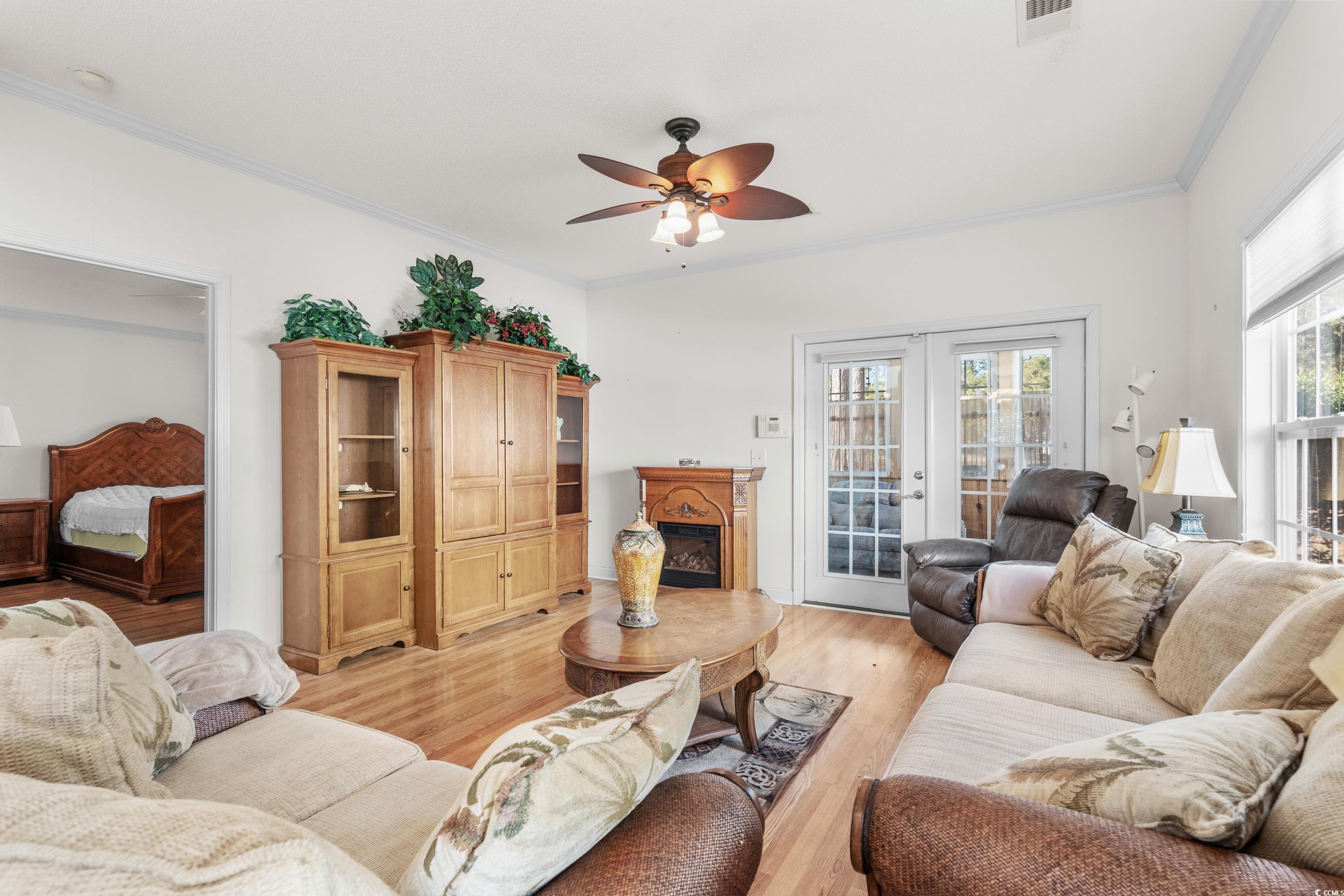 493 Shellbank Drive, Unit 2B Longs, SC 29568 - Photo 22 of 40 Living room featuring ceiling fan, light hardwood