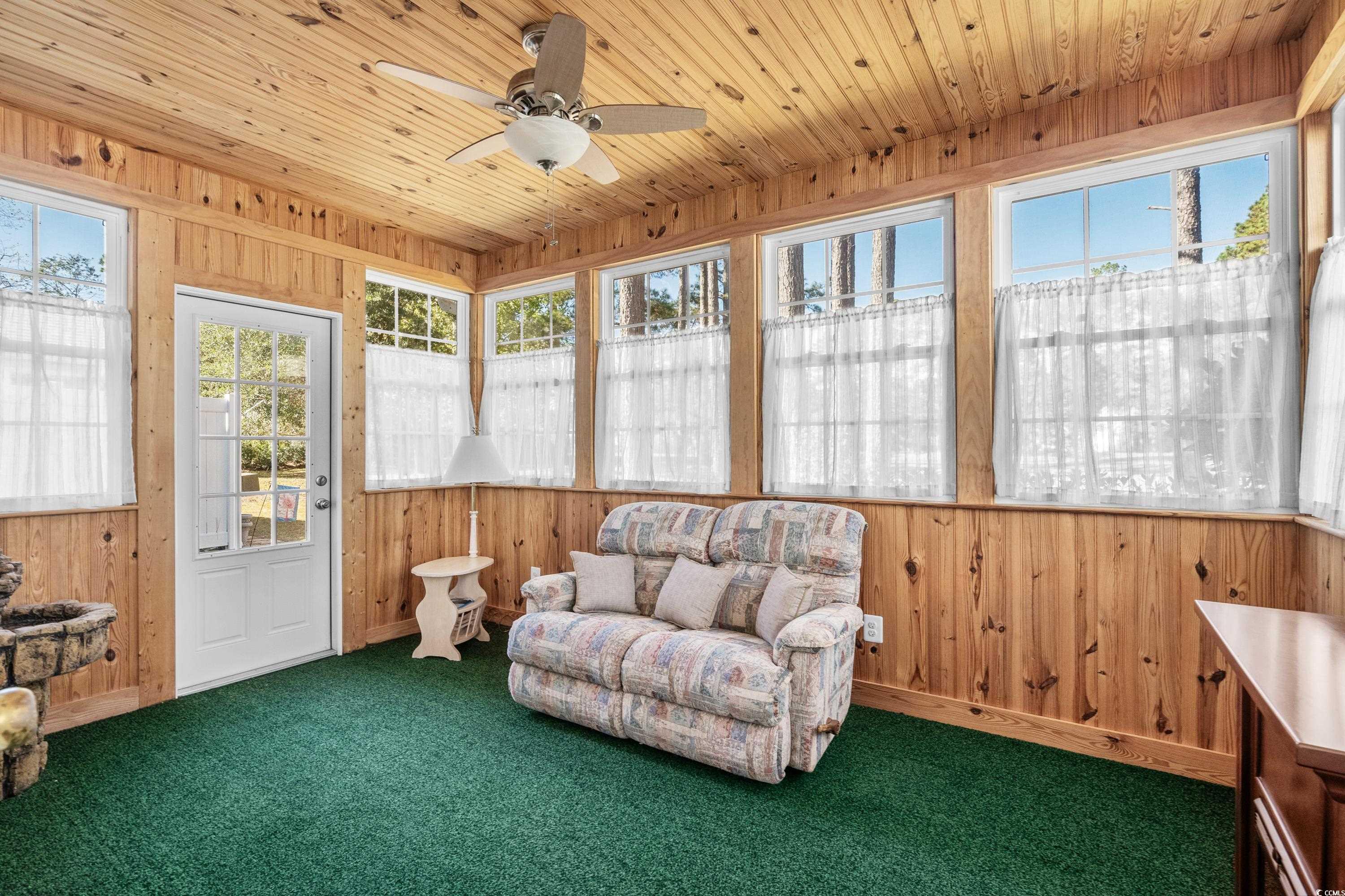 493 Shellbank Drive, Unit 2B Longs, SC 29568 - Photo 23 of 40 Sunroom with ceiling fan and wood ceiling