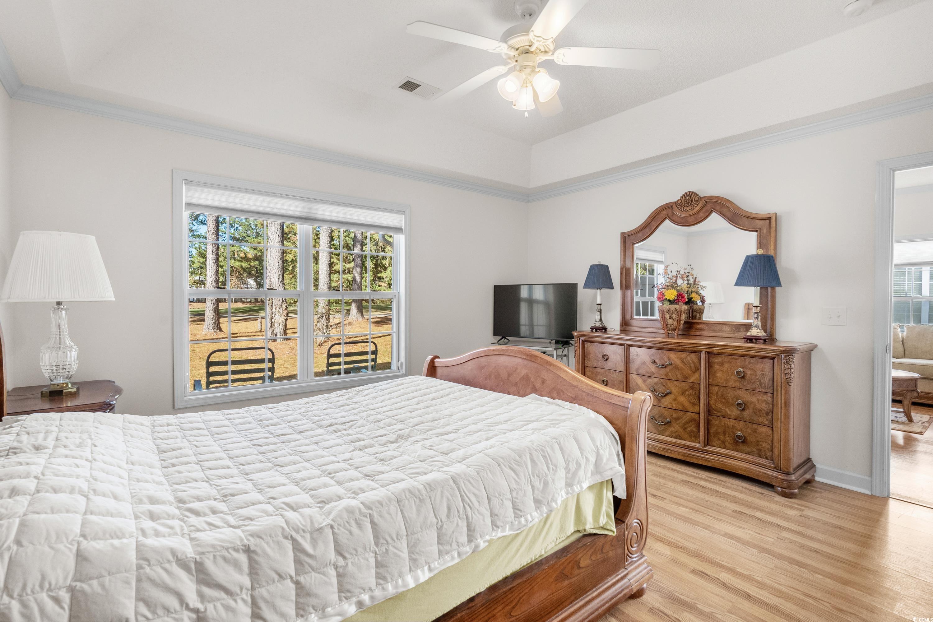 493 Shellbank Drive, Unit 2B Longs, SC 29568 - Photo 25 of 40 Bedroom featuring ceiling fan, light hardwood / wo