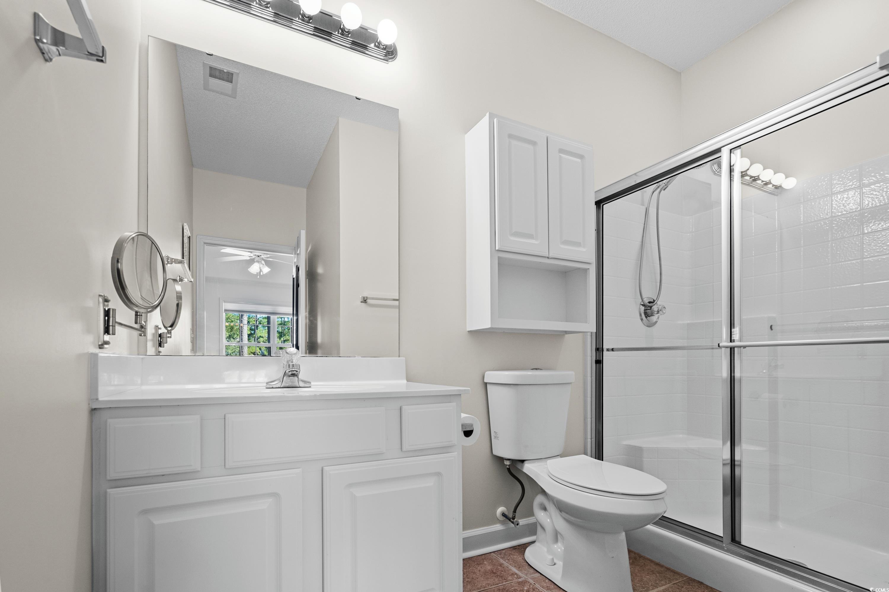 493 Shellbank Drive, Unit 2B Longs, SC 29568 - Photo 26 of 40 Bathroom with tile patterned floors, vanity, toile