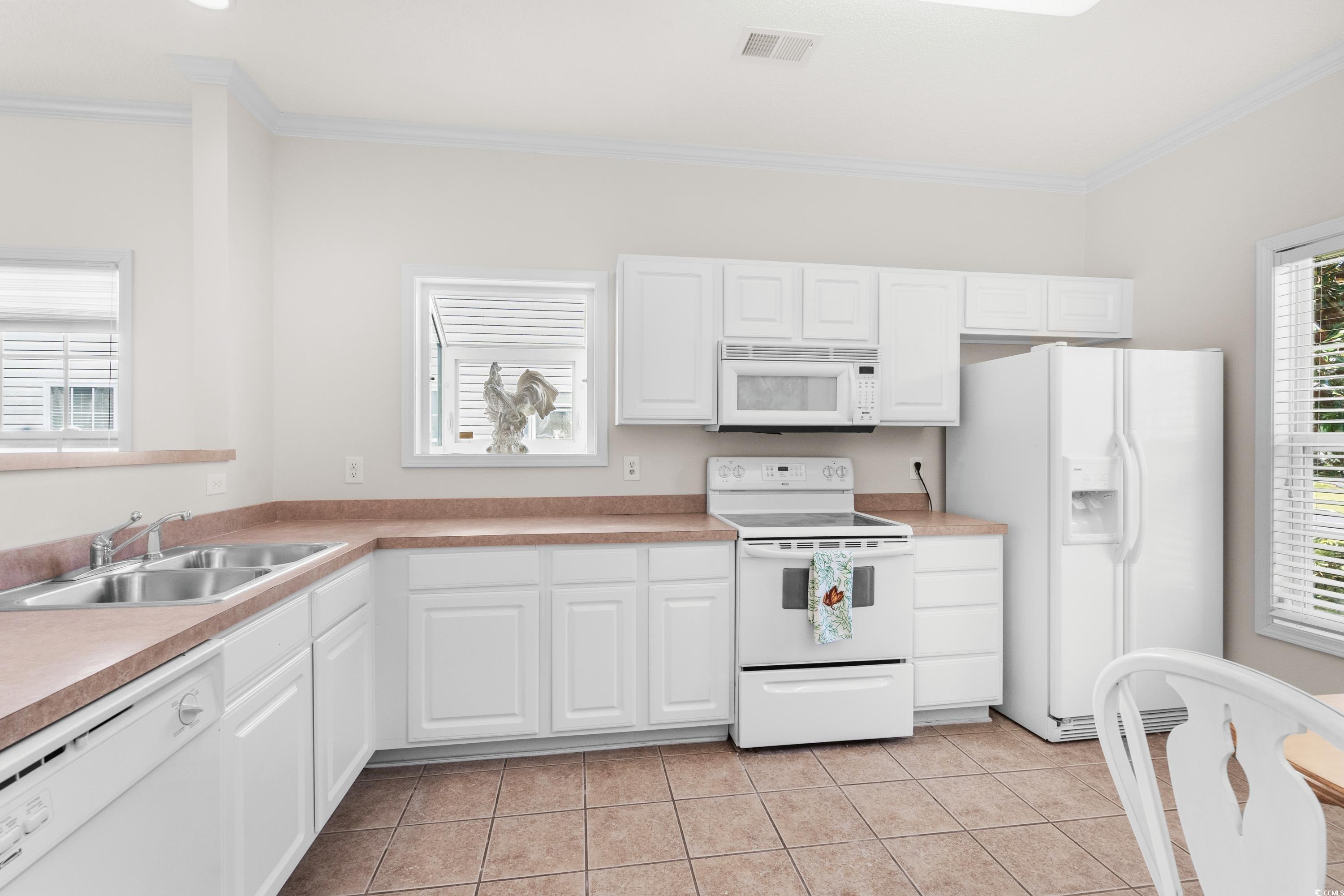 493 Shellbank Drive, Unit 2B Longs, SC 29568 - Photo 28 of 40 Kitchen with sink, white cabinets, white appliance
