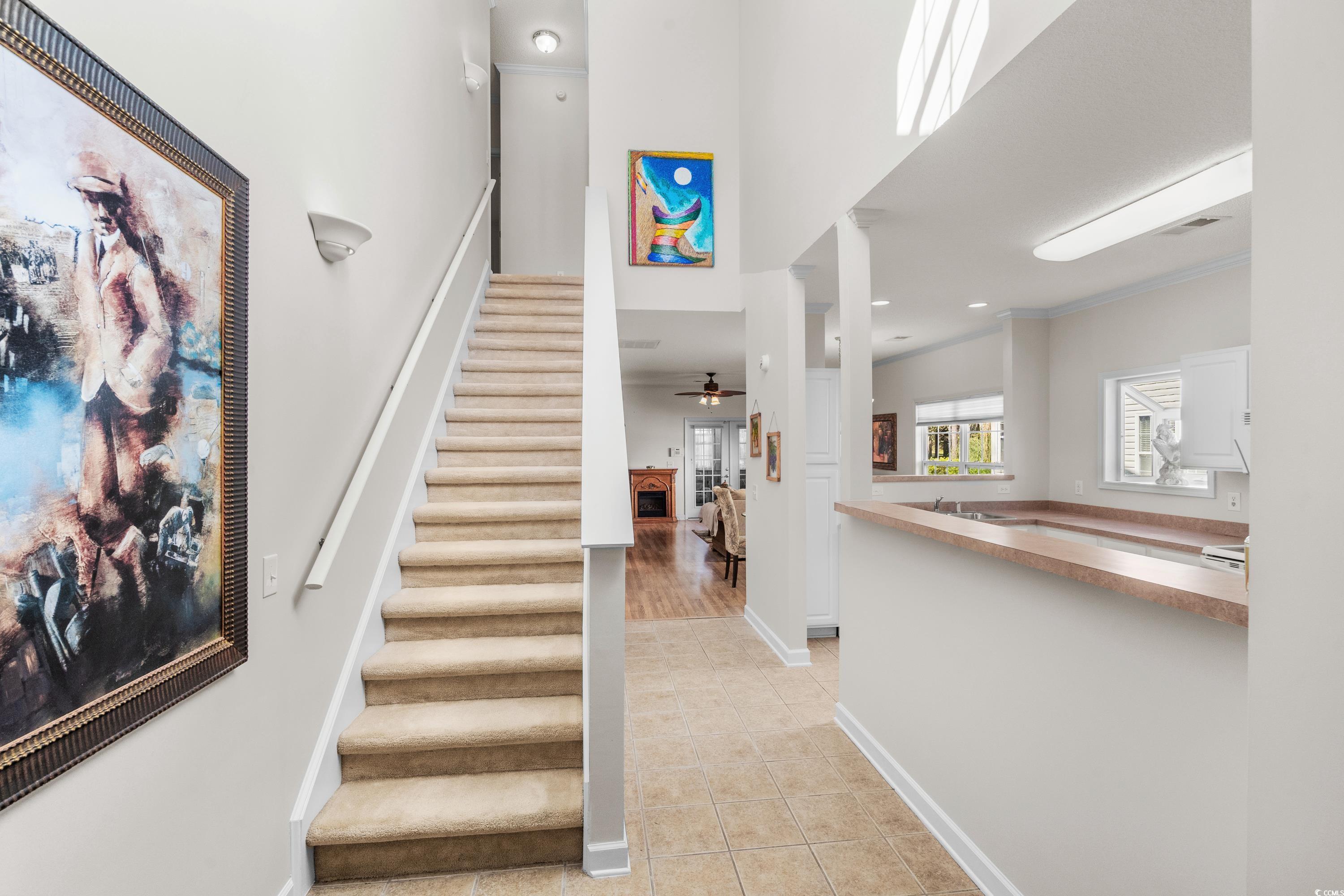 493 Shellbank Drive, Unit 2B Longs, SC 29568 - Photo 30 of 40 Staircase featuring tile patterned flooring, ceili