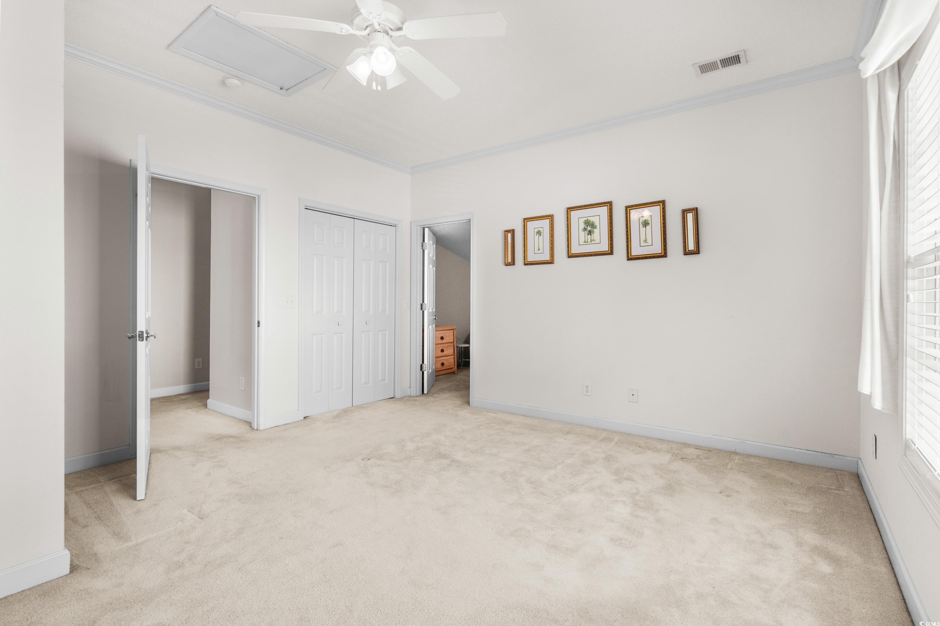 493 Shellbank Drive, Unit 2B Longs, SC 29568 - Photo 32 of 40 Unfurnished bedroom with ceiling fan, light colore
