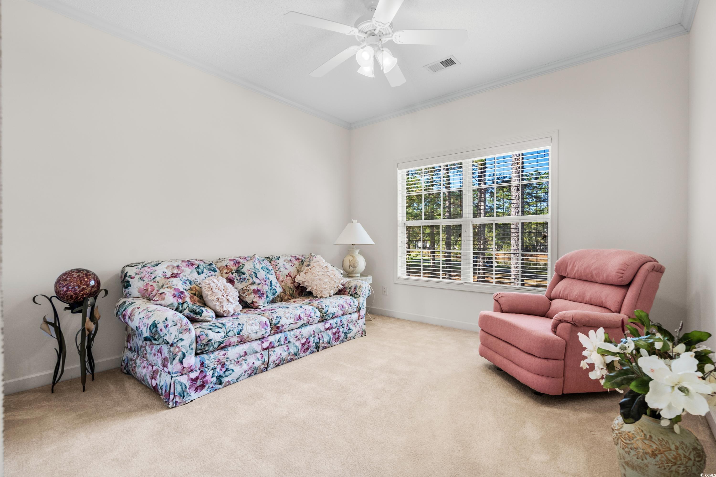 493 Shellbank Drive, Unit 2B Longs, SC 29568 - Photo 35 of 40 crown molding, ceiling fan, and light carpet
