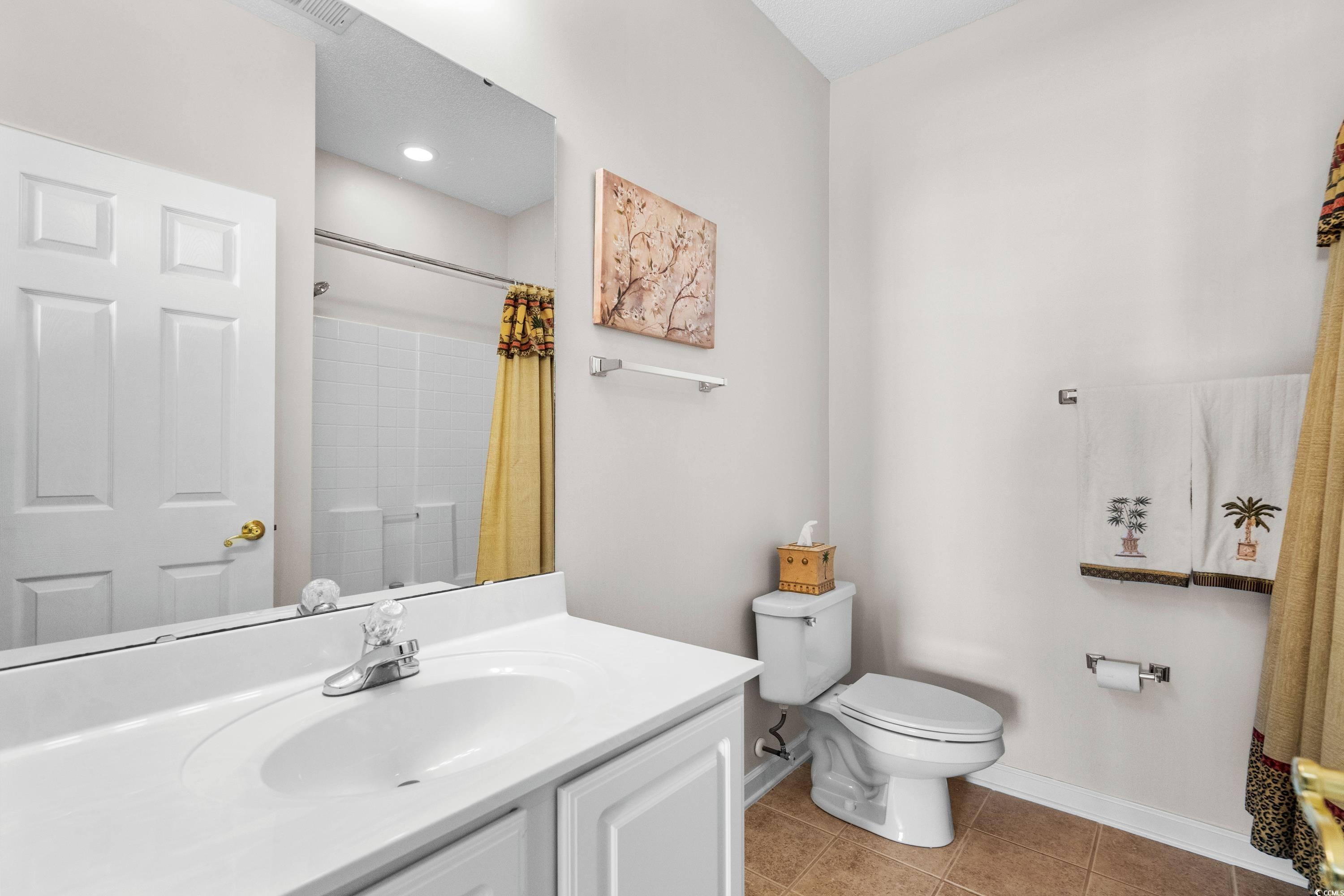 493 Shellbank Drive, Unit 2B Longs, SC 29568 - Photo 37 of 40 Bathroom with toilet, vanity, tile patterned floor