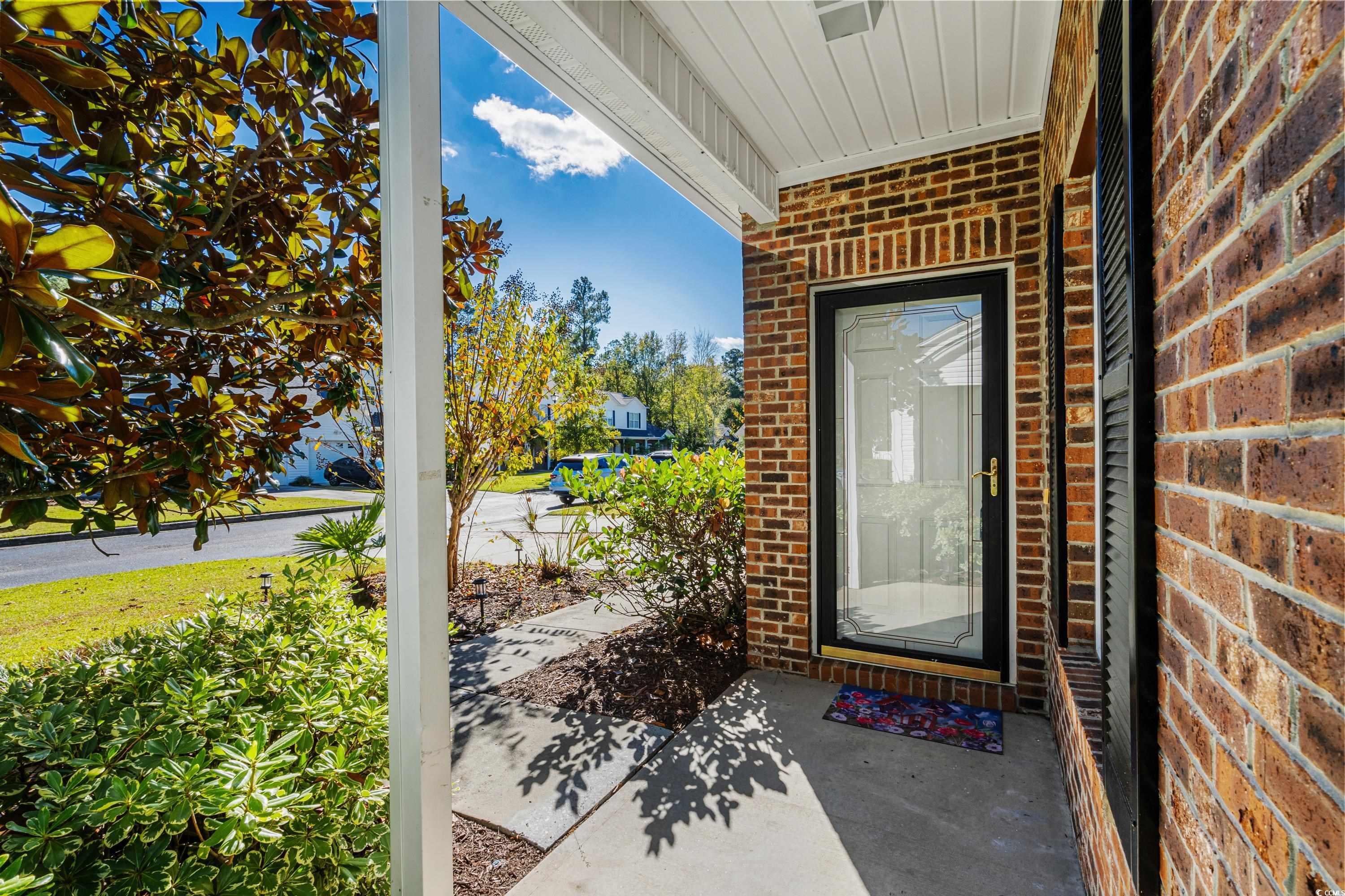 493 Shellbank Drive, Unit 2B Longs, SC 29568 - Photo 6 of 40 View of exterior entry with covered porch