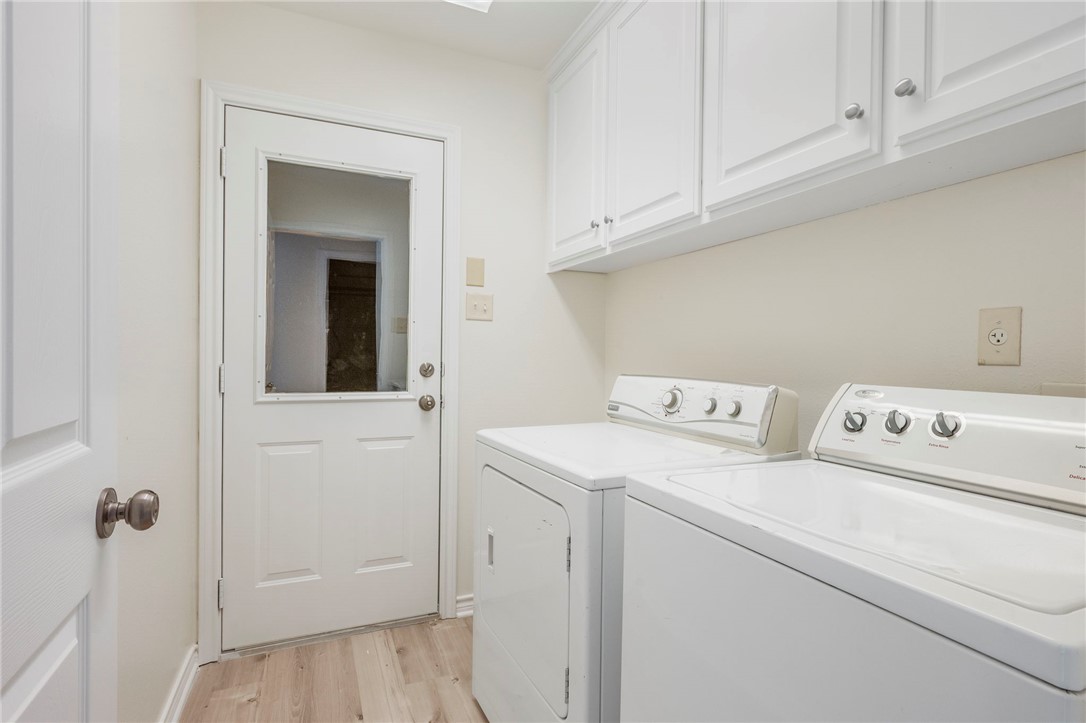 1604 Winfield Court Bryan, TX 77802 - Photo 12 of 14 a utility room with dryer and washer