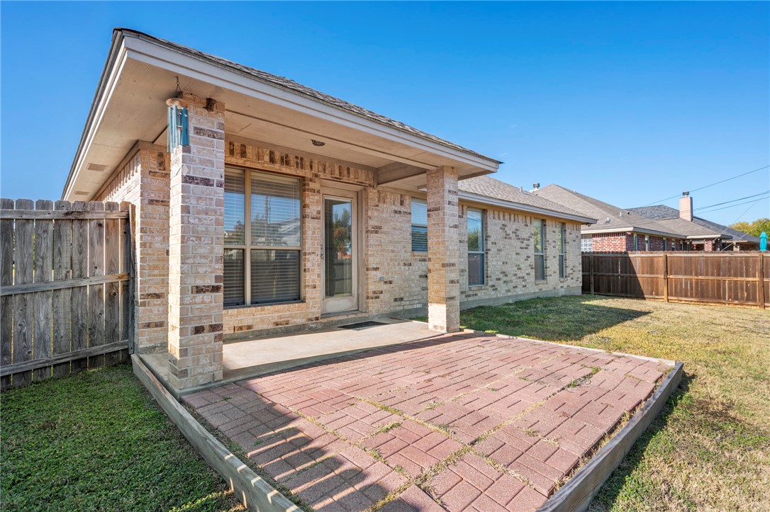 1604 Winfield Court Bryan, TX 77802 - Photo 13 of 14 a front view of a house with a yard